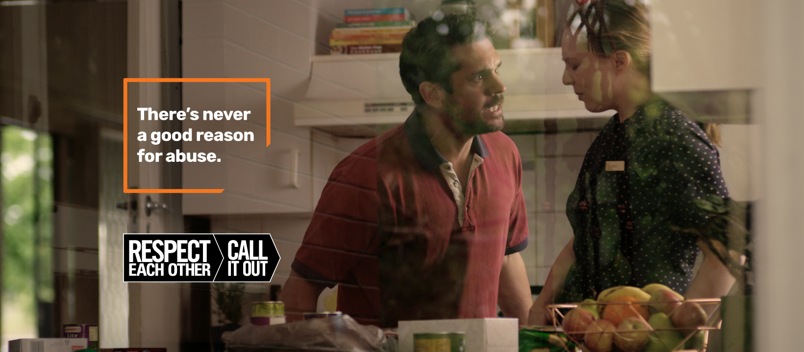 Respect each other campaign image, man verbally abusing woman standing in kitchen