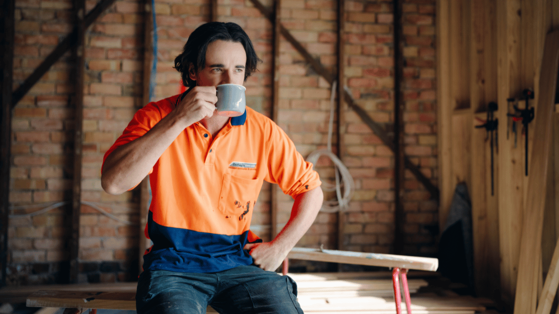 Jack, a What Kind of Man Do You Want to Be participant, takes a tea break on a worksite.