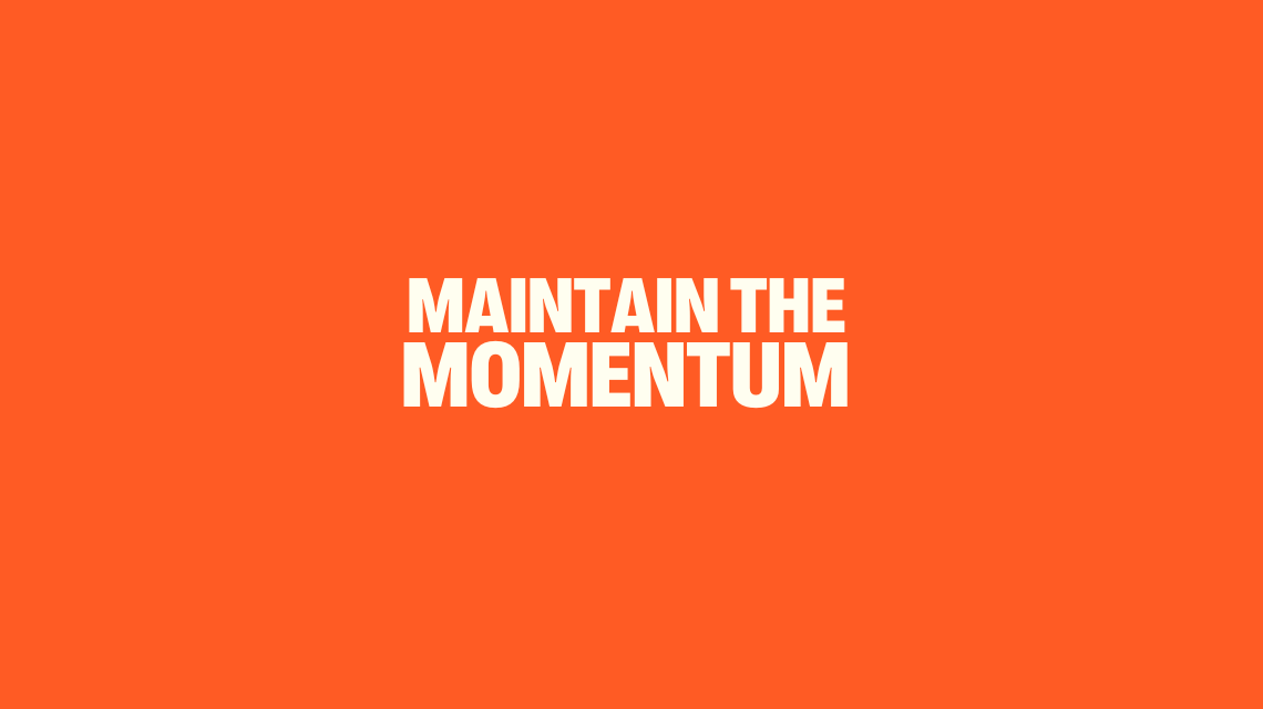 Maintain the Momentum - cream text on orange background