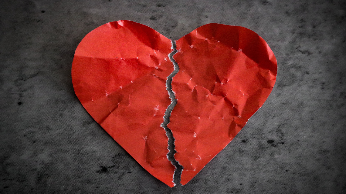 A bright red heart split down the middle with jagged edges